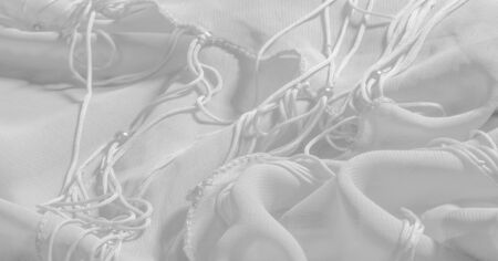 Background, pattern, texture, wallpaper, white silk fabric has a brilliant shine. This is the most...