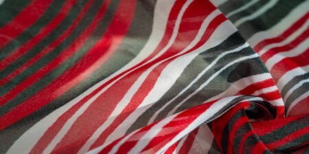 Background texture. multicolored striped silk fabric. Mexican coloring theme bright colored striped pattern with abstract stripesの写真素材
