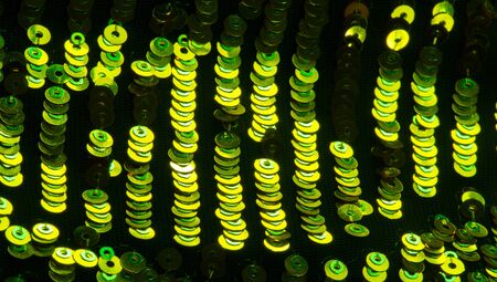 pattern background texture fabric with sequins Die and light this dazzling fabric This heavy fabric has a mesh base with large multi-colored sparkles on the front side It is perfect for your projectsの写真素材