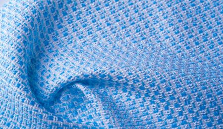 Texture, fabric, pattern. Large weave of blue and white threads, tightly woven fabric with a very...