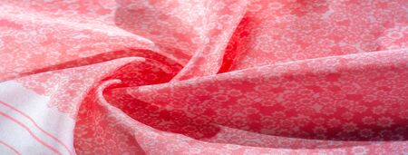 Texture, background, pattern, pink silk fabric on a white background, small flowers pattern...