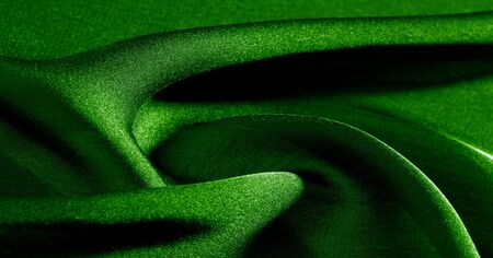 Background, pattern, texture, wallpaper, green silk fabric. Add a touch of luxury to any design by adding it to this ultra-soft and very lightweight polyester lining fabric.の写真素材