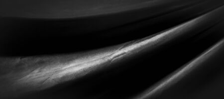 texture, background, pattern. Black silk fabric. It is black and heat resistant with gray. Transform...
