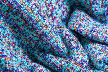 Background texture, pattern. Winter fabric, warm. big braided thread. Blue-red yellow threads. This photo will make your design the best. Wallpapers, pictures, posters.の写真素材