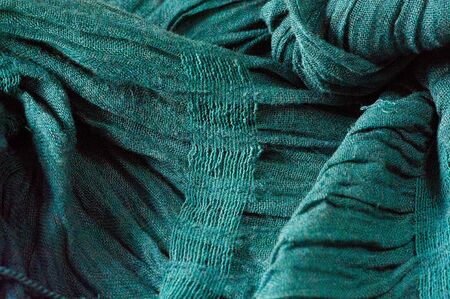 texture, pattern, background. Women's scarf turquoise, harvested material