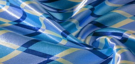 texture background pattern. silk fabric with geometric shapes squares. These figures help to easily...