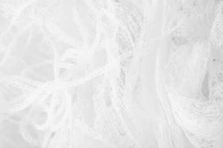 Texture background pattern white fabric in a mesh Thanks to a unique combination and clean design this is an impressive fabric It is great for all kinds of your design, decor, decorations, wallpapersの写真素材