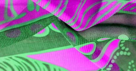 texture background pattern wallpaper. Green pink black silk fabric pattern. This medium-weight rayon fabric has a nice shine with slight color variations. Perfect for adding elegance to your designsの写真素材