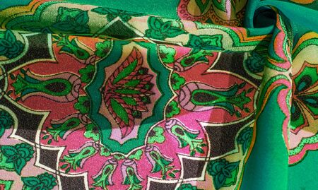 texture, background, multicolored silk fabric with a pattern of patterns on a green background,...