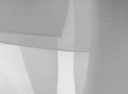 texture background pattern. White silk fabric with a subtle matte sheen. It is perfect for your design, accents, wallpapers, posters and postcards.の写真素材
