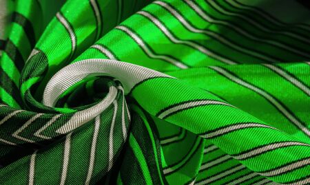 Texture,  silk fabric with a green striped pattern. The design of this fabric is devoted to a...