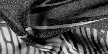 texture, background, pattern, wallpaper. Black white silk fabric pattern. This medium-weight rayon fabric has a nice shine with slight color variations. Perfect for adding elegance to your designs.の写真素材