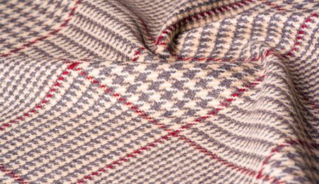 Background texture, pattern. The fabric is thick, warm in a cage, beige. This is 100% wool terry...