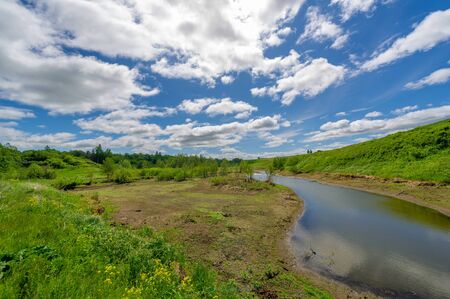 Spring photography, meadows, fields, ravines, hills, rural landscape. A deep, narrow gorge with...