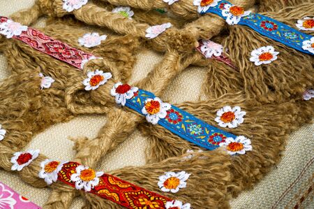 Flea market,  folk crafts. Handmade rag dolls. A rag doll is a children's toy. It is a cloth figure,...