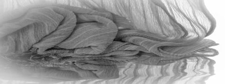 Texture, background, pattern, silk fabric of gray steel color with small corrugation, ground, context, fond, foil, fieldの写真素材