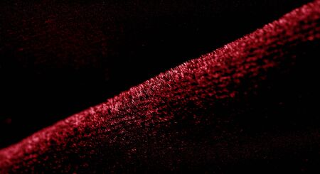Texture background, pattern. red velveteen. Rock the runway with this beautiful high fashion fabric. This medium weight fabric has a beautiful shine with a velvet face for a feeling of luxury.の写真素材
