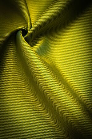 texture, background, pattern, pattern, chocolate, silk fabric, tight weaving, photo studio. Green, green-yellow, chartreuse fabric color, the play of light and shadow make this photograph unique,の写真素材