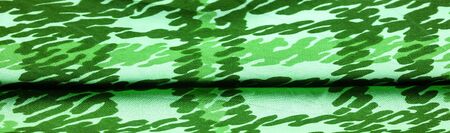Background design texture, green silk fabric, abstraction, copyright print, military camouflage...