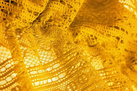 Background, texture, pattern, yellow lace fabric, thin open fabric, usually made of cotton or silk,...