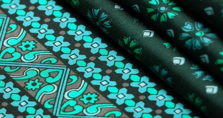 silk fabric of green color with blue and white flowers, dense fabric, bilateral on the basis of triacetate fibers. Texture, Background, Pattern, Decor, Modern, Textile, Art, Design,の写真素材