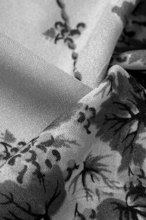 Texture, background, pattern, Crepe de Chin. Beige color, blue flowers. This is a group of silk, characterized by roughness, as well as slightly wrinkled.の写真素材