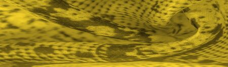 Background, texture, pattern, yellow fabric with a pattern of yellow squares, lines,
