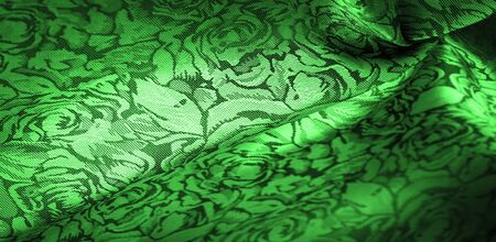 relief pattern, composite textiles, green silk fabric with a floral pattern, unusually pleasant visual sensations: slippery, coolness, softness; beautiful appearance, unique luster;の写真素材