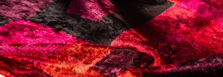 Texture, background, pattern, design, red yellow brown velvet fabric, dense fabric of silk, cotton or nylon with a thick short pile on one side.の写真素材