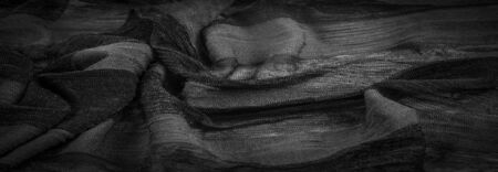 Texture, background, design, light transparent silk fabric in black and white, Soft-touch material is available in a rainbow of colors to blend with the latest developments of your projectsの写真素材