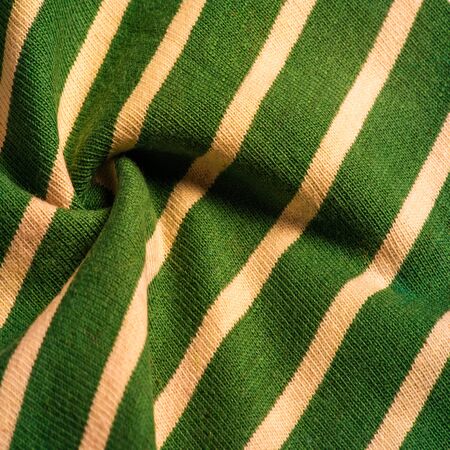 Texture, background, pattern, design, fabric from green and white woolen stripes, woolen knitwear that is elegant and pleasant to work with. Great for your projects.の写真素材