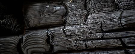 blurry shallow depth of field, texture, background, pattern, design, wood after a fire, fire created an intricate patternの写真素材