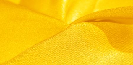 Texture, background, pattern, silk fabric in yellow. This silk is incredibly exquisite. Projects...