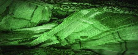 Background texture, decorative ornament, dark Lilac blue silk fabric, floral pattern, corrugation, reef, wavy, wavy, ripple, small wave or a series of waves on the surface of the fabric,の写真素材