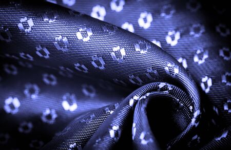 Background texture, decorative ornament, sky blue silk fabric, blue sapphire, a fine, strong, soft, lustrous fiber produced by silkworms in making cocoons and collected to make thread and fabric.の写真素材