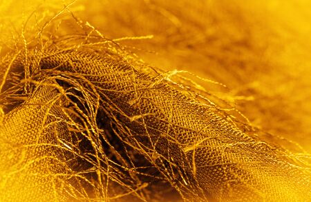 Background texture, decorative ornament, yellow gold silk fabric, woven threads on the fabric, fluffy effect, sensation, appearance or texture of a surface or substance,
の写真素材