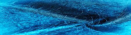 Background texture, decorative ornament, blue silk fabric, woven threads on the fabric, fluffy...