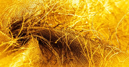 Background texture, decorative ornament, yellow gold silk fabric, woven threads on the fabric, fluffy effect, sensation, appearance or texture of a surface or substance,
の写真素材