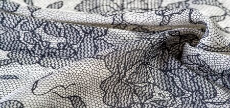 texture, background, pattern. Silk white fabric with lace patterns. This elastic lace trim can add a...