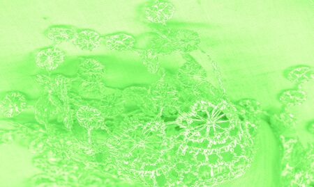 Texture, background, pattern, postcard, silk fabric, female spring green scarf with lace wrappers. Use these fancy images to create your print and digital materials.の写真素材