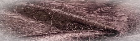 Background texture, decorative ornament, brown silk fabric, woven threads on the fabric, fluffy...