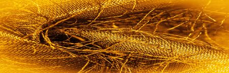 Background texture, decorative ornament, yellow gold silk fabric, woven threads on the fabric, fluffy effect, sensation, appearance or texture of a surface or substance,
の写真素材