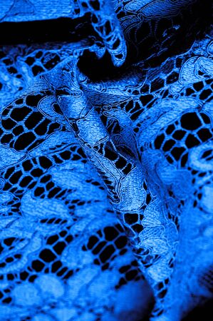 Texture, background, pattern, blue lace fabric, delicate embossed lace fabric, scalloped on both edges. Suitable for your projects, design, etc.の写真素材
