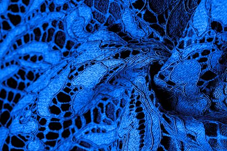 Texture, background, pattern, blue lace fabric, delicate embossed lace fabric, scalloped on both edges. Suitable for your projects, design, etc.の写真素材