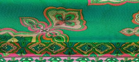 texture, background, multicolored silk fabric with a pattern of patterns on a green background,...
