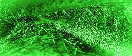 Background texture, decorative ornament, green silk fabric, woven threads on the fabric, fluffy effect, feeling, appearance or texture of the surfaceの写真素材