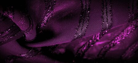 the ornament of the decor, the transparent fabric is purple-red with brightly innate stripes, the material allowing the light to pass through it so that the objects behind are clearly visible.の写真素材