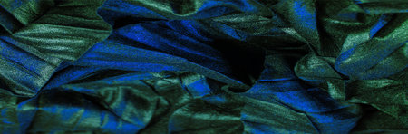texture. background. pattern. wallpaper. black silk fabric with blue emerald stripes, wrinkled fabricの写真素材