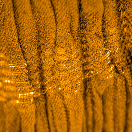 The texture of the background pattern, ornament decor, golden yellow corrugated fabric, fabric with...