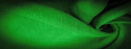 The texture of the wallpaper, ornament decor, deep emerald silk dense fabric of green cent, you can make (something) more attractive by adding decorative elementsの写真素材